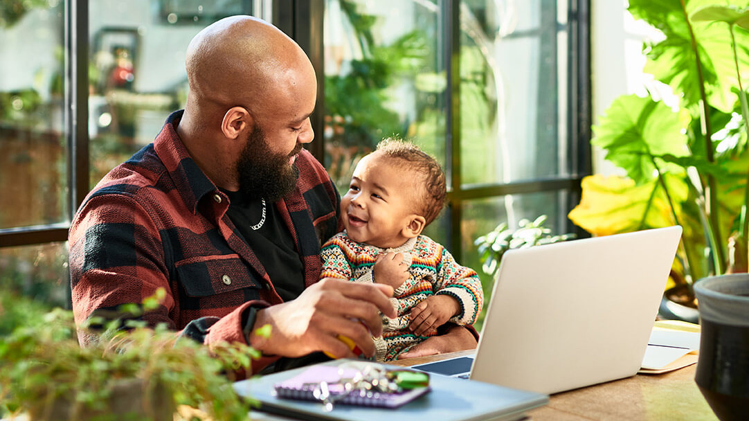 Parent at home with a young child, suggesting stability and household documentation.